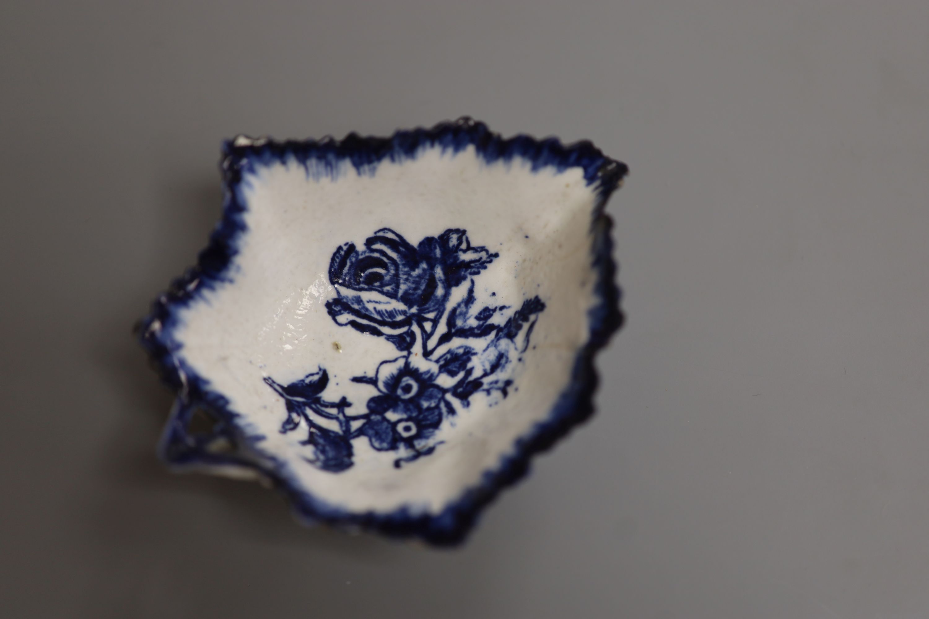 A Derby leaf shaped pickle dish printed with roses, under a painted border ex. Gilbert Bradley Col., green GB mark, length 9.5cm